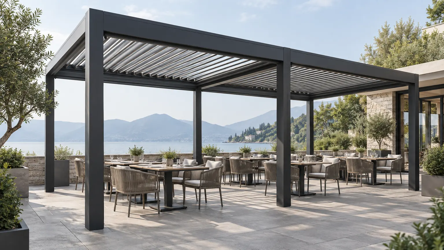 Commercial aluminum louvered pergola covering an outdoor dining terrace